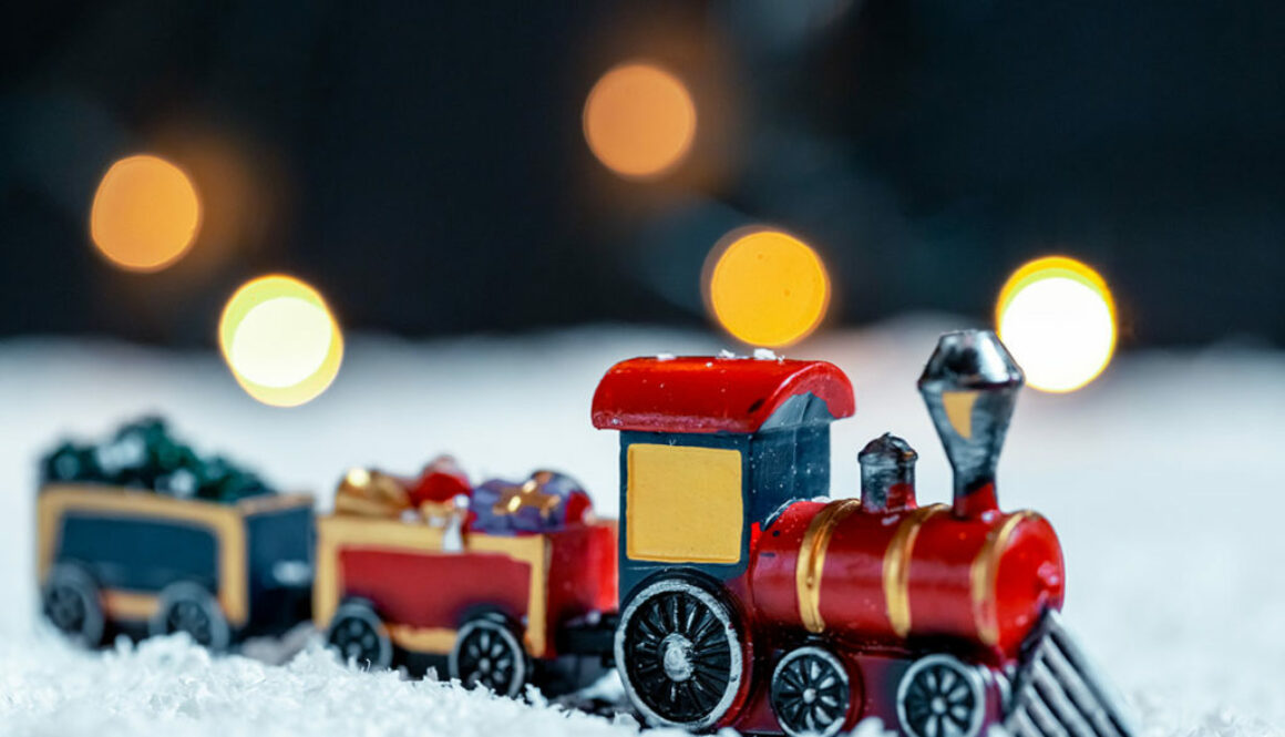 The Christmas train in the snow on bokeh background